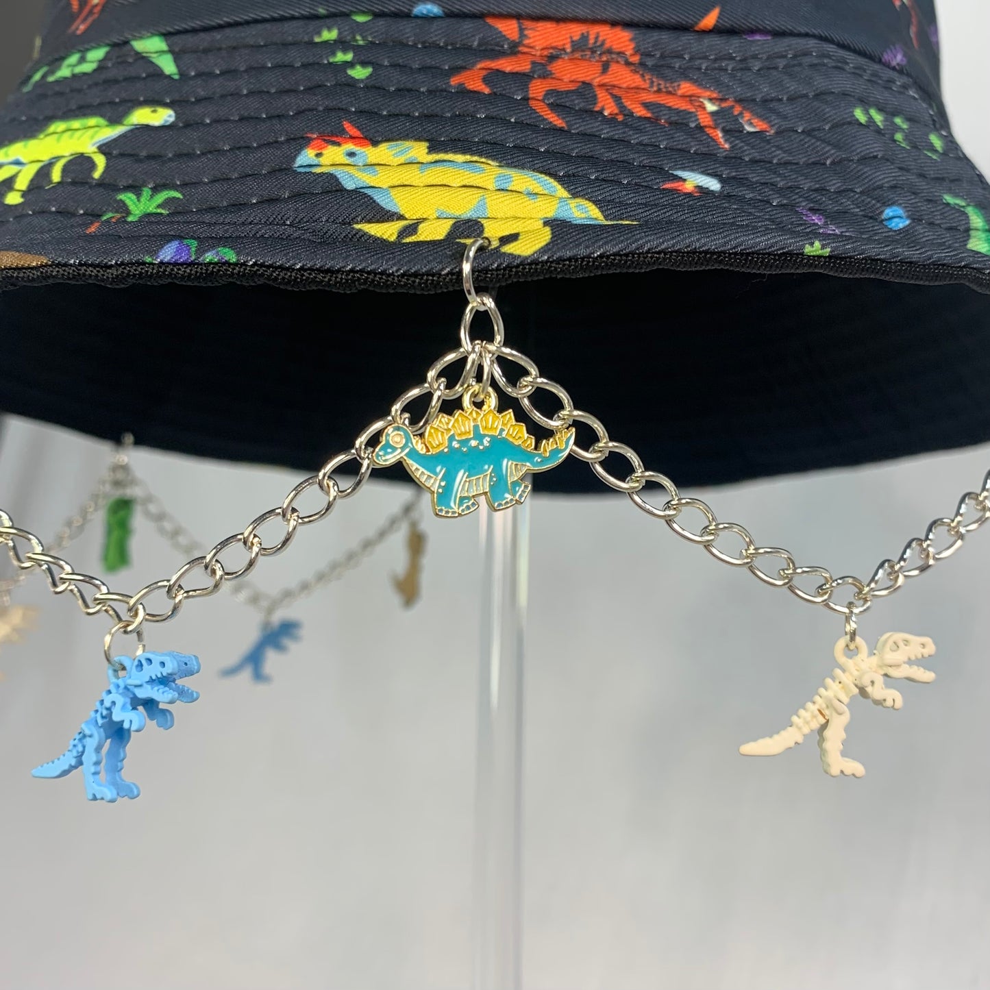 Saur Through The Past! Dinosaur Chain and Charm Bucket Hat