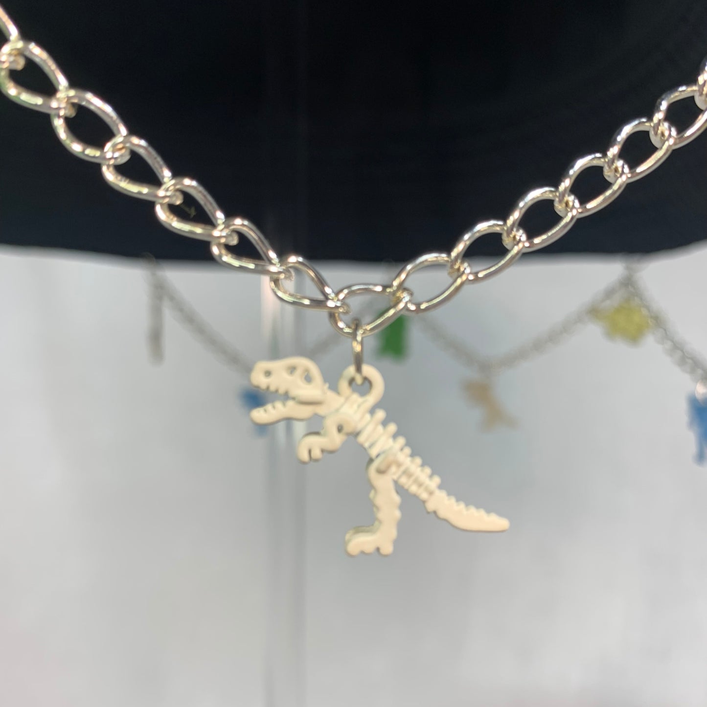 Saur Through The Past! Dinosaur Chain and Charm Bucket Hat